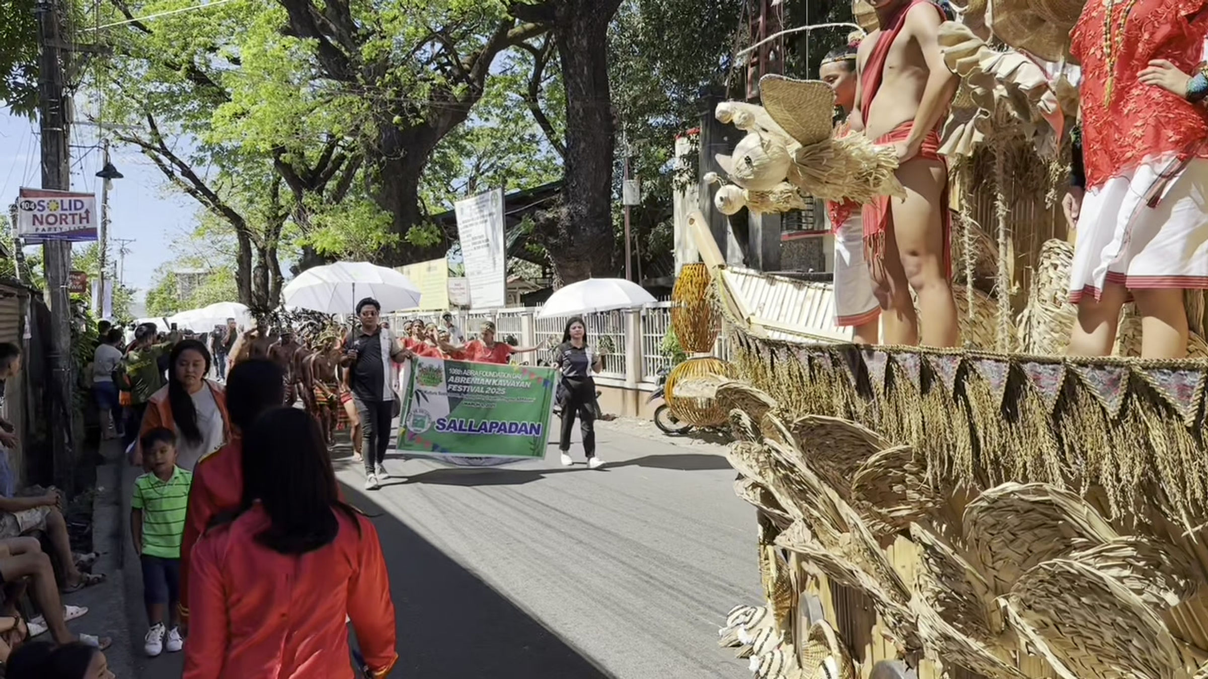 Bamboo float followed by Tingguian dancers at the parade of the Kawayan Festival 2025